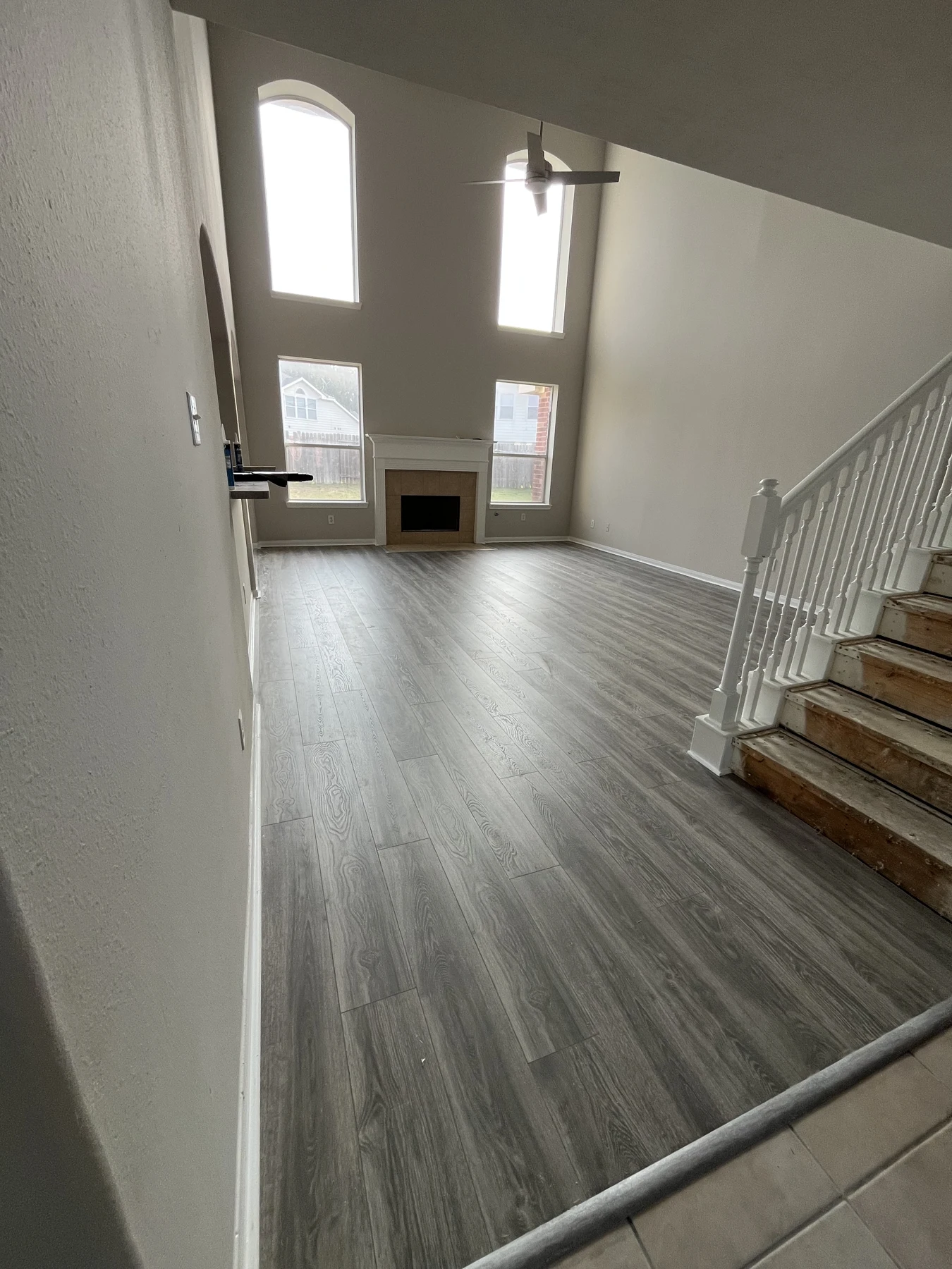 Completed living area with gray plank flooring